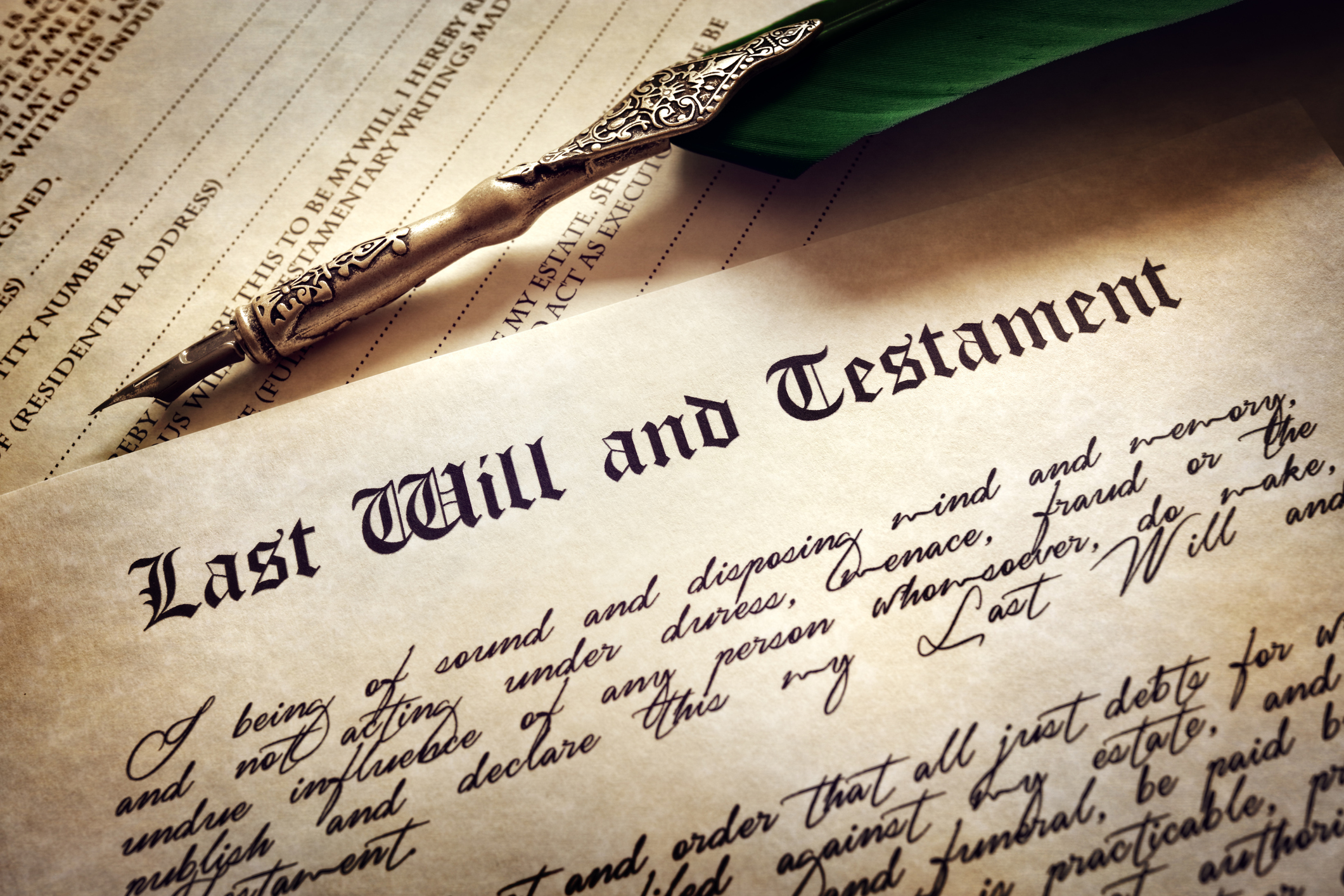 Last Will and Testament document with quill pen and handwriting